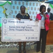 Public Protector Thuli Madonsela hands over a cheque of R30 000 to Aurora Girls High School in Soweto. Image: Public Protector South Africa.