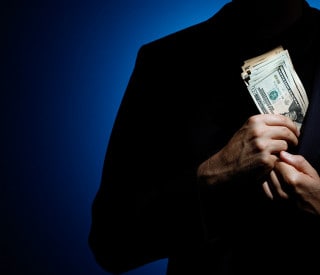 Businessman taking a bribe