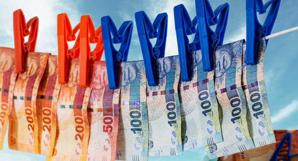 Laundered South African banknotes hanging on the washing line