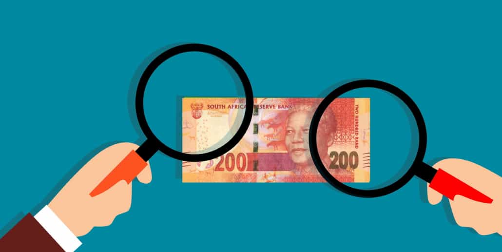 Magnifying glass on South African rand note