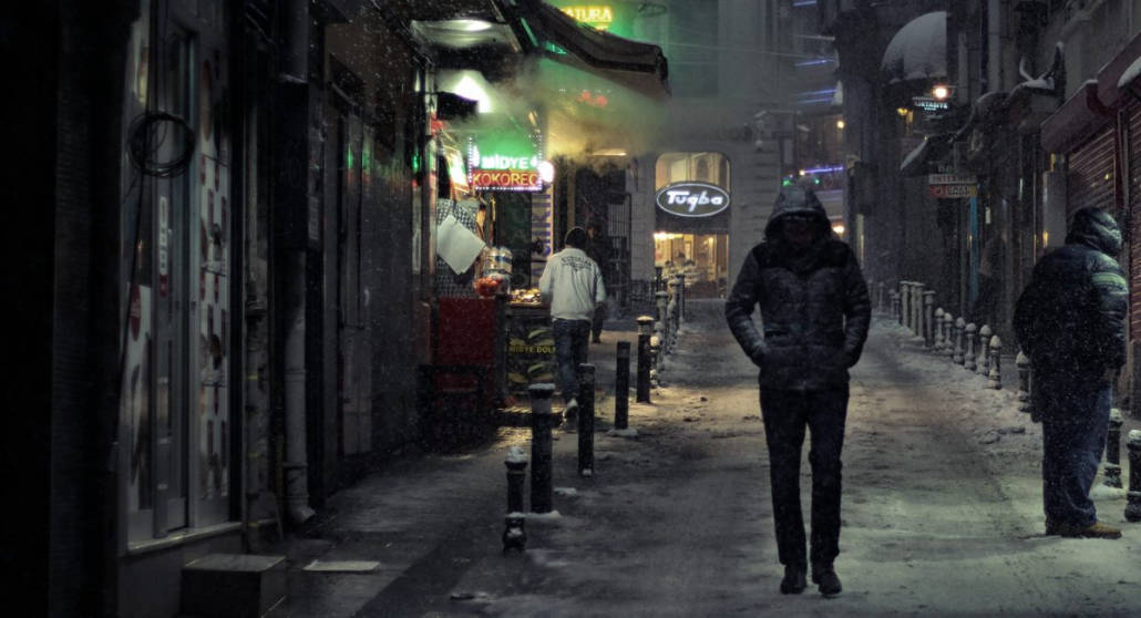 A man walking alone at night