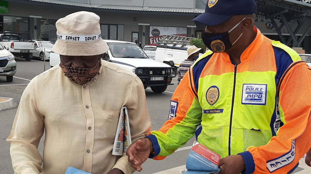 A JMPD officer talking to a member of the public