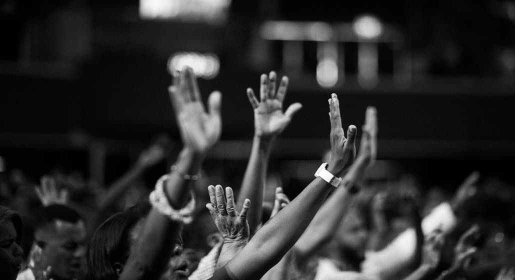 Photo of hands raised in the air