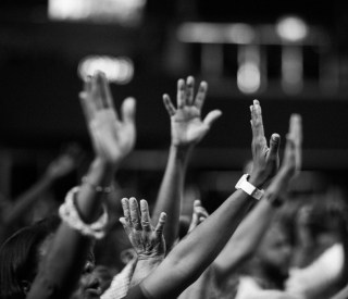 Photo of hands raised in the air