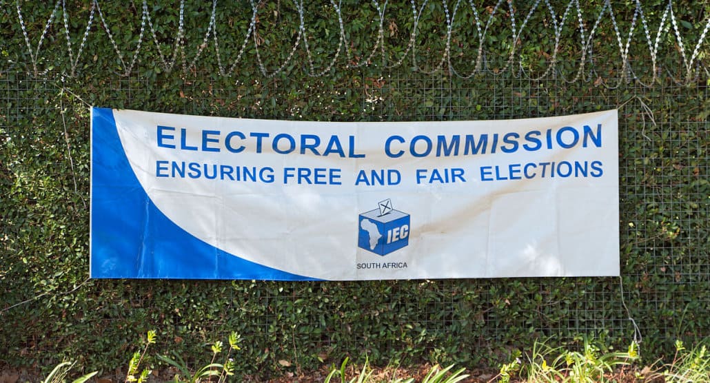 An Independent Electoral Commission banner hanging on a fence