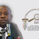 Justice Mbuyiseli Madlanga, next to the banner and logo of the Madlanga commission into criminality in the criminal justice system