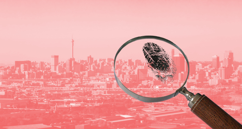 A magnifying glass examining a fingerprint, superimposed on a representation of the Johannesburg skyline