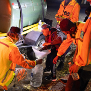Twelve-year-old volunteer Ismail Tayob of Ridgeway in Johannesburg helps members of the Southern Suburbs Community Forum and Water Project fill water containers. Photos: Alaister Russell